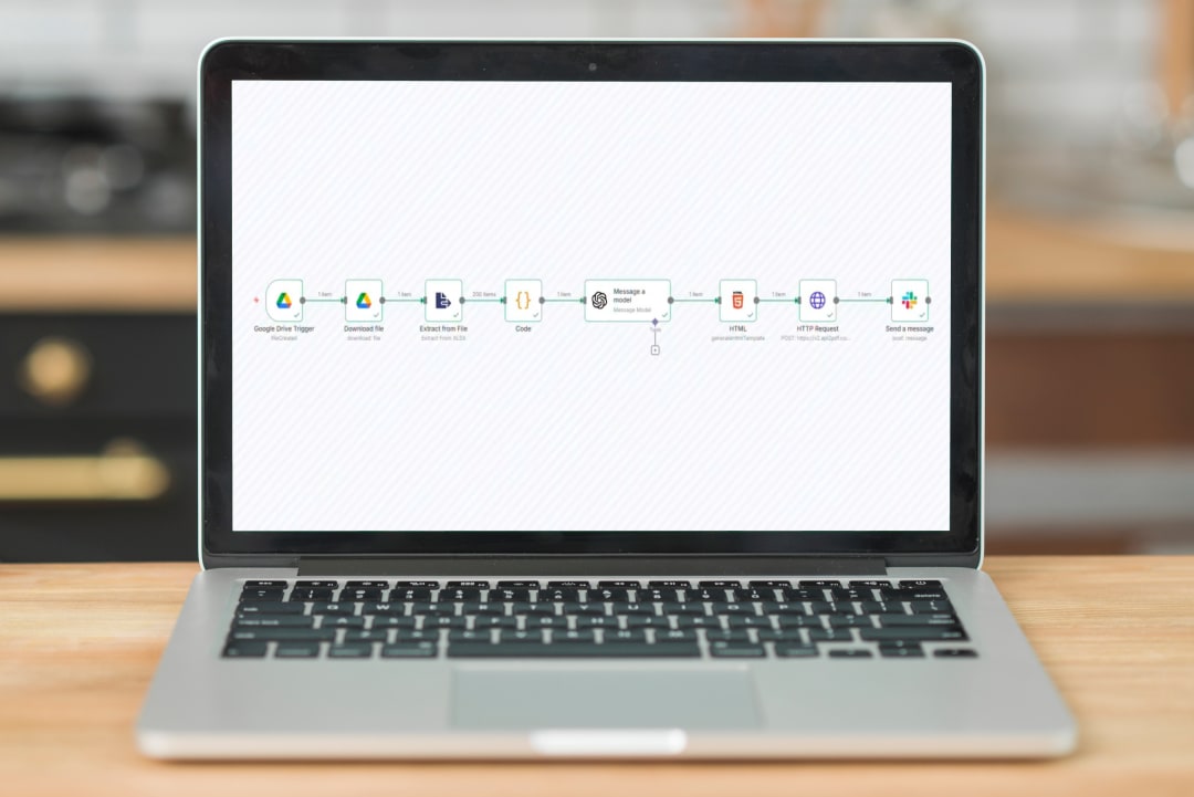 Laptop showing the automated workflow that analyses player behaviour and posts a report to Slack